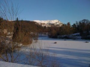 Dumyat with frozen loch in foreground